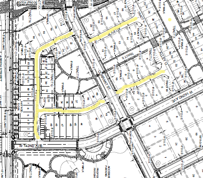 A detailed street map with labeled roads and plots, highlighting certain pathways in yellow.