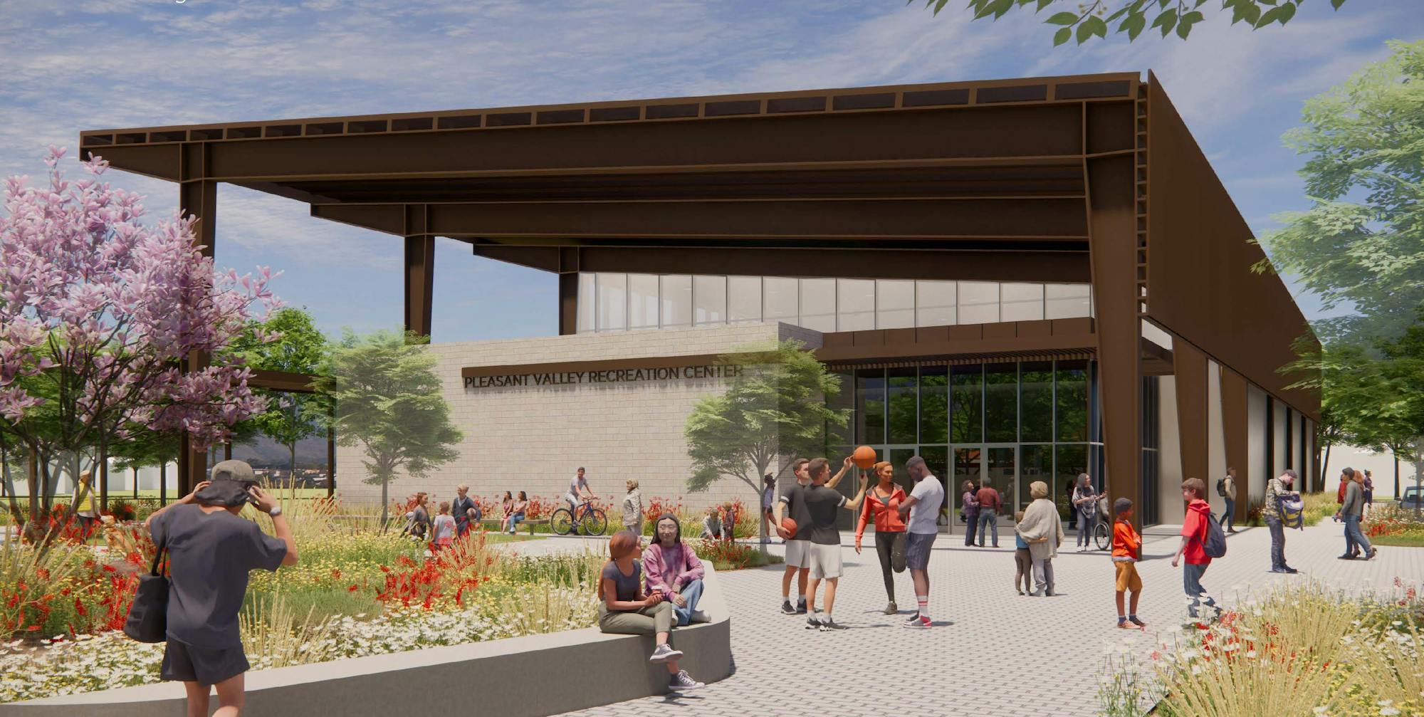 Click this link to view renderings. The button containing the link is a rendering of the multiuse facility facing the south end of the building. There are people in the foreground and a building in the back.