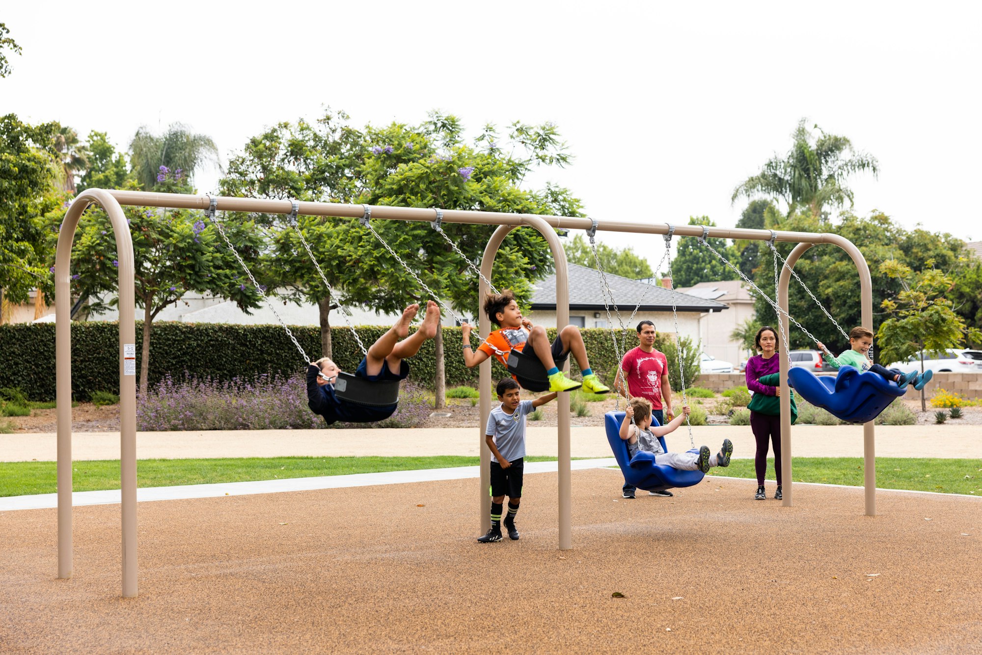 May contain: person, human, play area, playground, swing, and toy