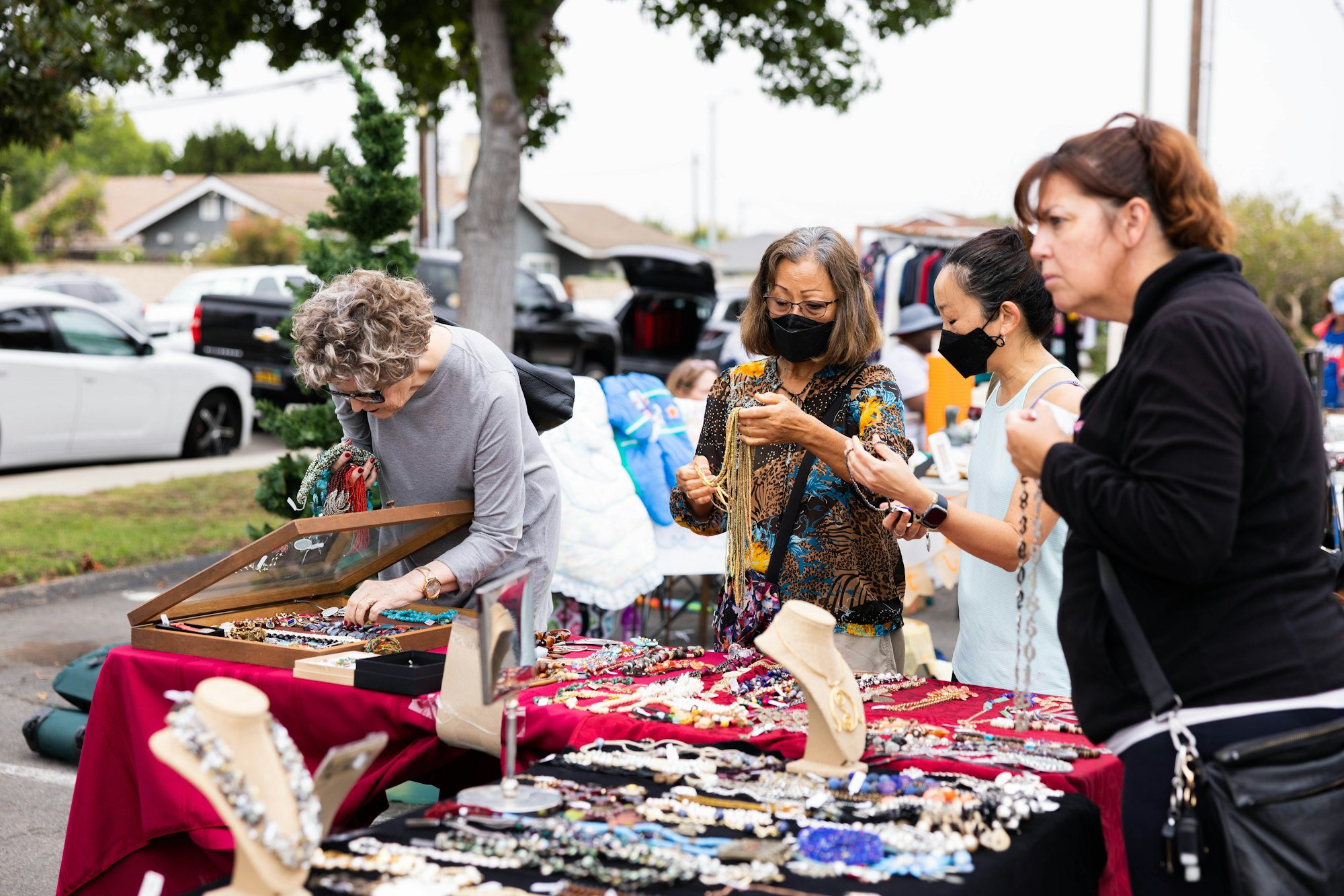 May contain: adult, female, person, woman, accessories, bag, handbag, car, transportation, vehicle, market, and people