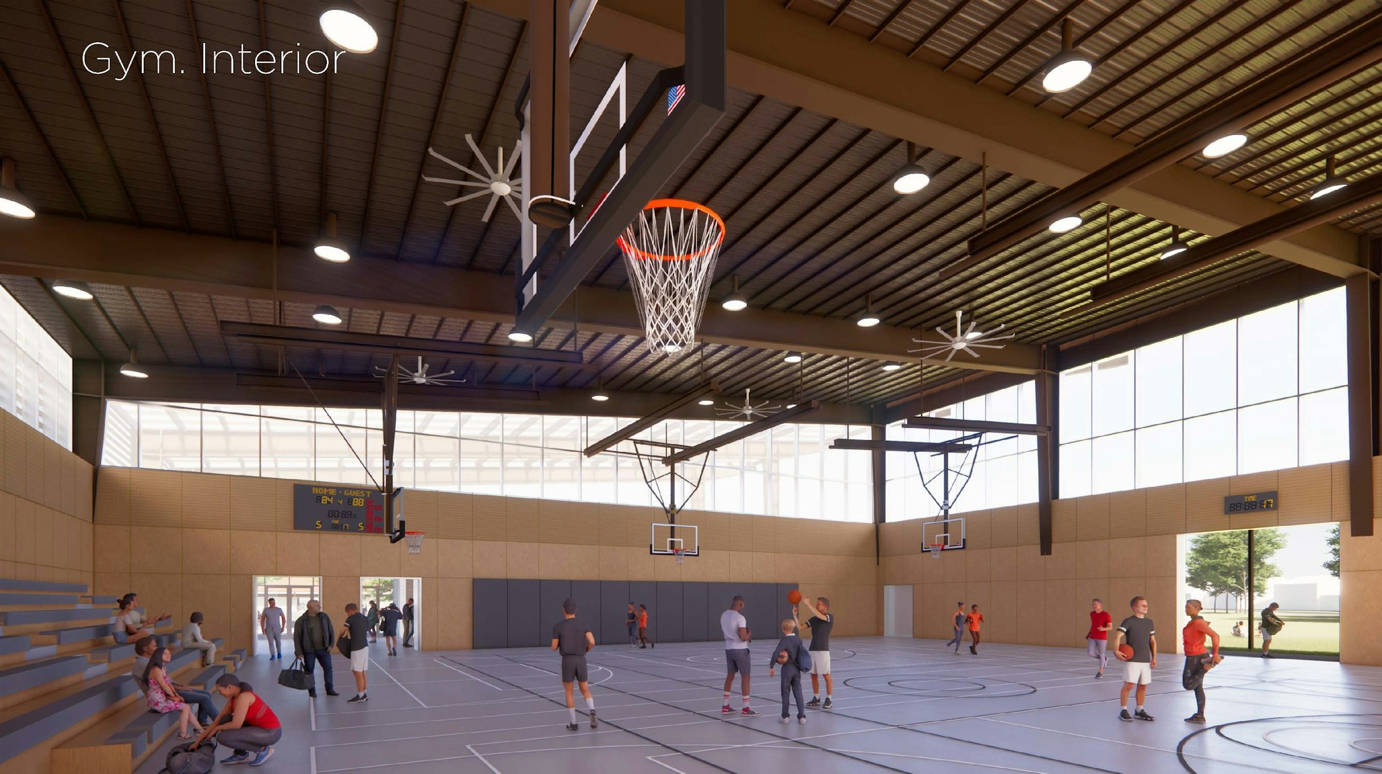 A spacious gym interior with basketball courts, players, bleachers, and large windows allowing natural light.