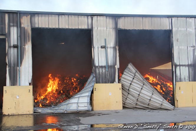 image of large garage filled with fire