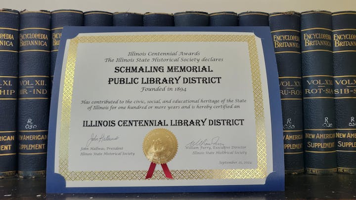 An Illinois Centennial Library District award certificate for Schmaling Memorial Public Library District from Illinois State Historical Society, dated September 21, 2024.