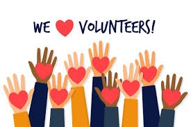 Raised hands holding hearts with the text "We ā¤ļø Volunteers!"