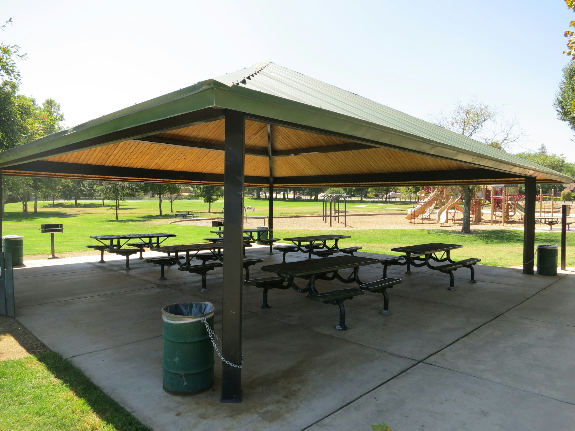 May contain: architecture, building, outdoors, shelter, desk, furniture, table, house, housing, patio, grass, plant, and bench