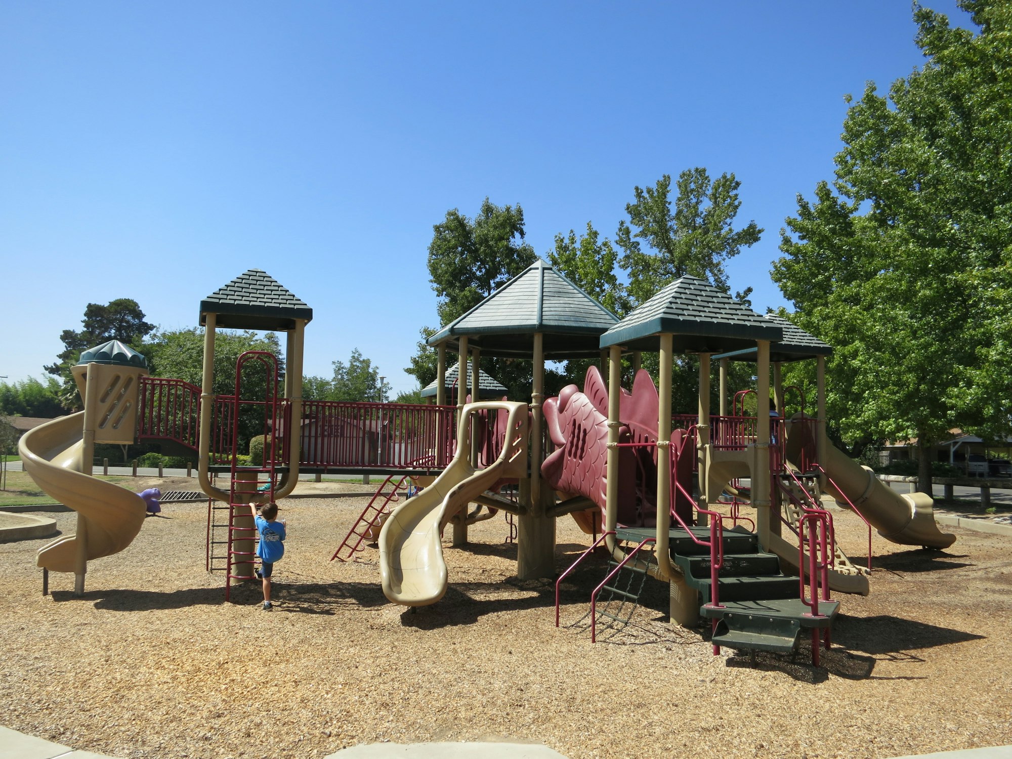 May contain: outdoor play area, outdoors, play area, person, clothing, footwear, and shoe