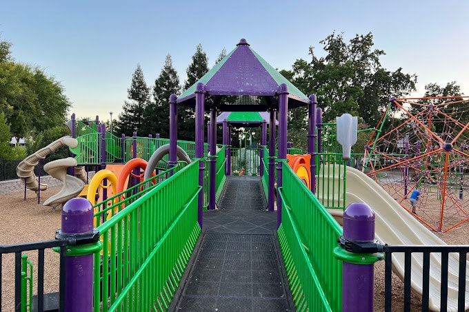 May contain: outdoor play area, outdoors, play area, and person