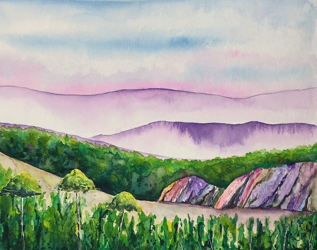 A watercolor landscape with green hills, colorful rocks, and misty, purple mountains under a pink and blue sky.
