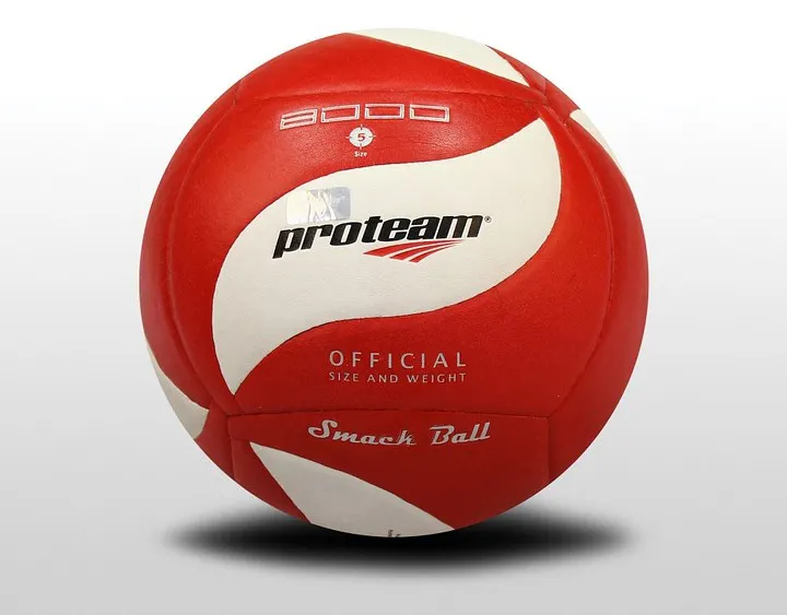 A red and white volleyball labeled "proteam," marked as an official size and weight "Smack Ball."