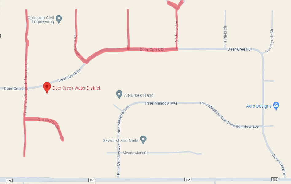 A map showing streets, the Deer Creek Water District marker, and points of interest like Colorado Civil Engineering and businesses.