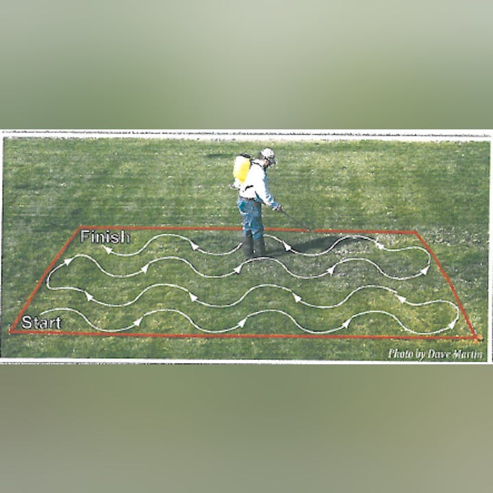 Person spraying lawn in zigzag pattern from start to finish.