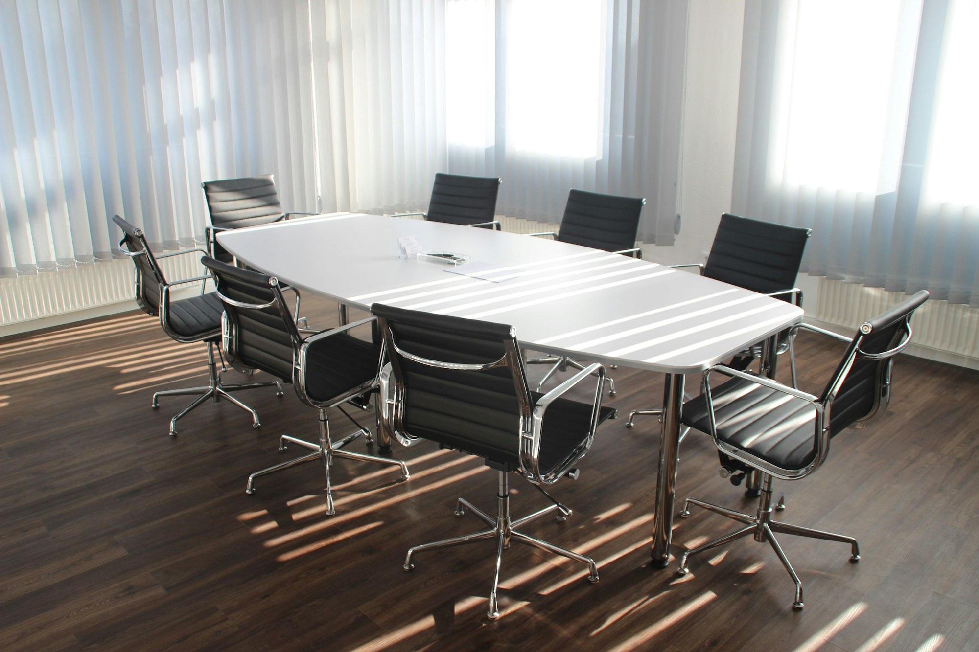 empty chairs around an empty table