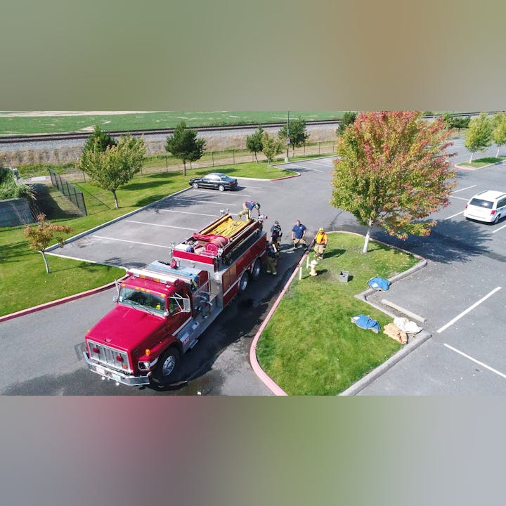 May contain: car, vehicle, transportation, truck, person, fire truck, wheel, and machine