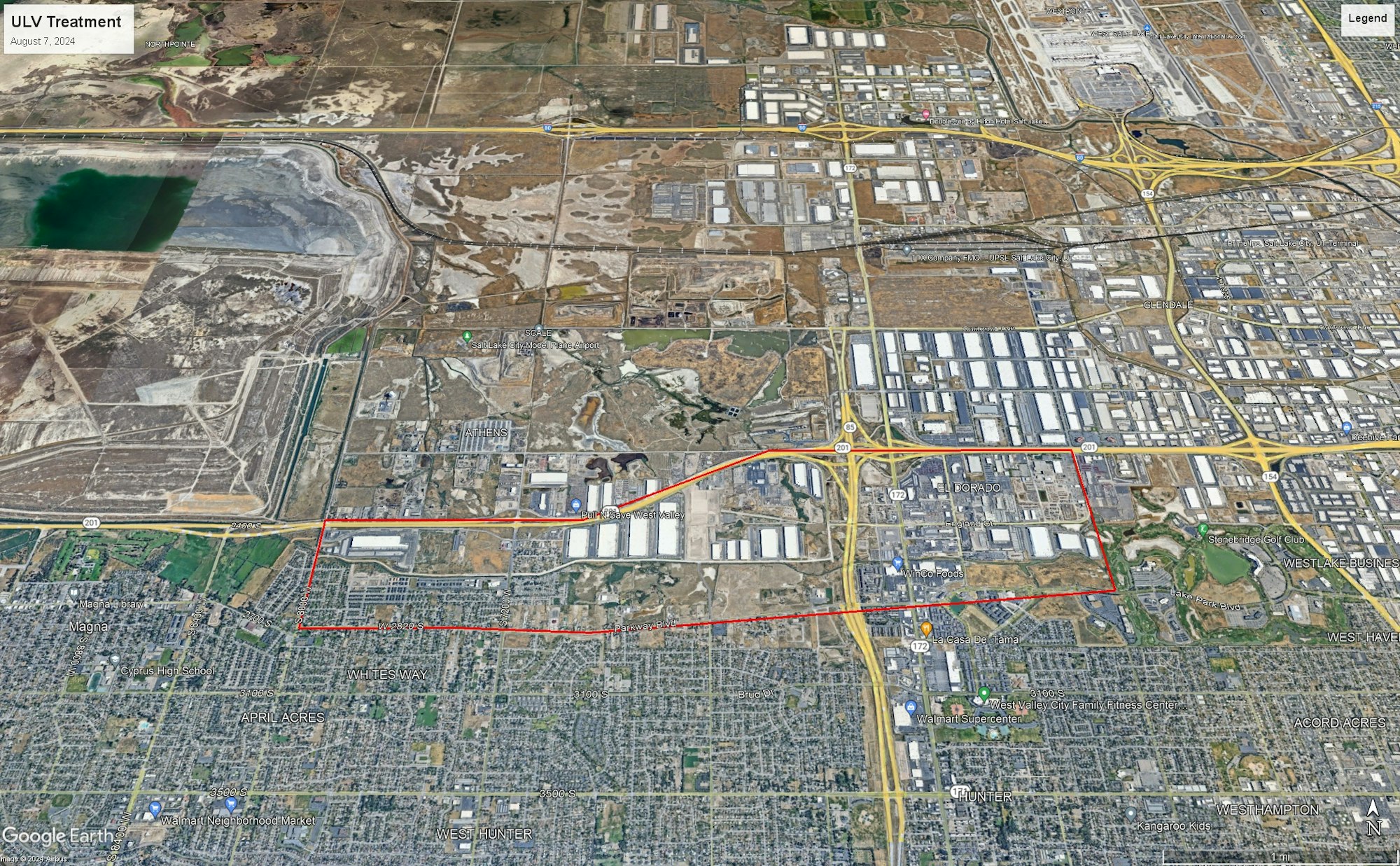 Aerial city view with industrial, residential areas, and marked boundaries.