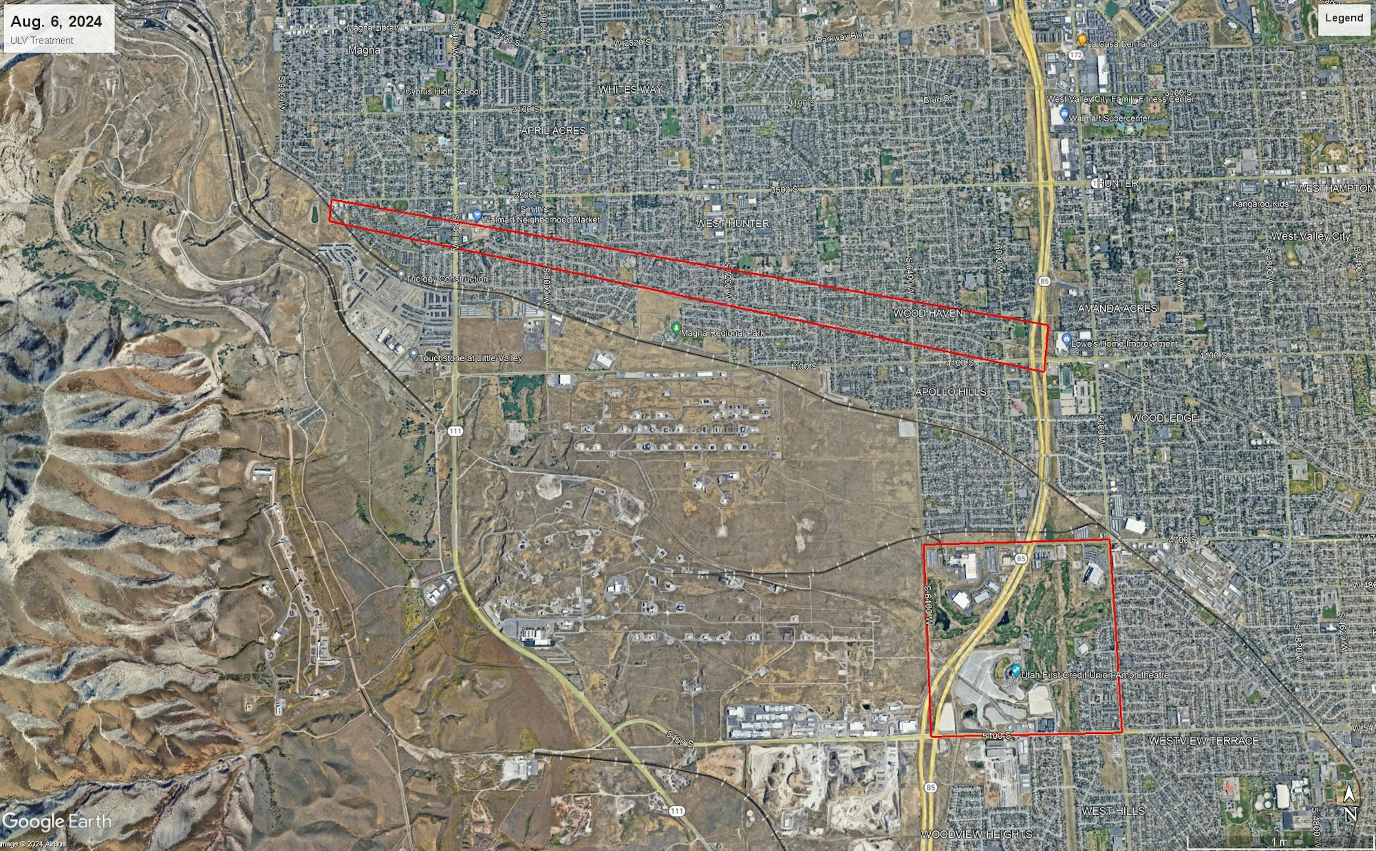 Aerial view of urban area with marks for a treatment area and a specific location highlighted.