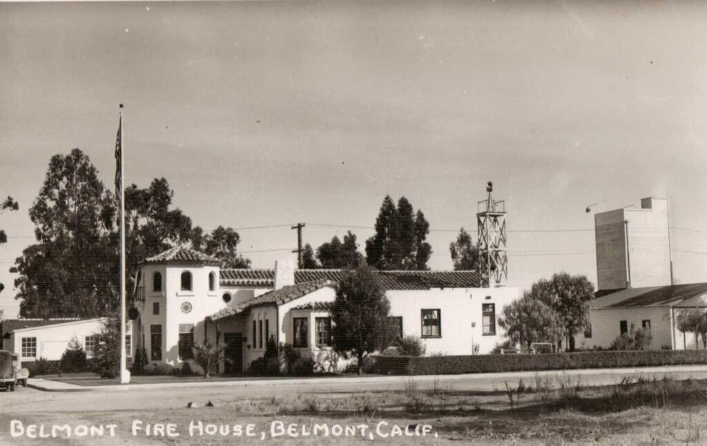 Belmont Fire House in Belmont, California, featuring a historic building with a flagpole and trees in the background.