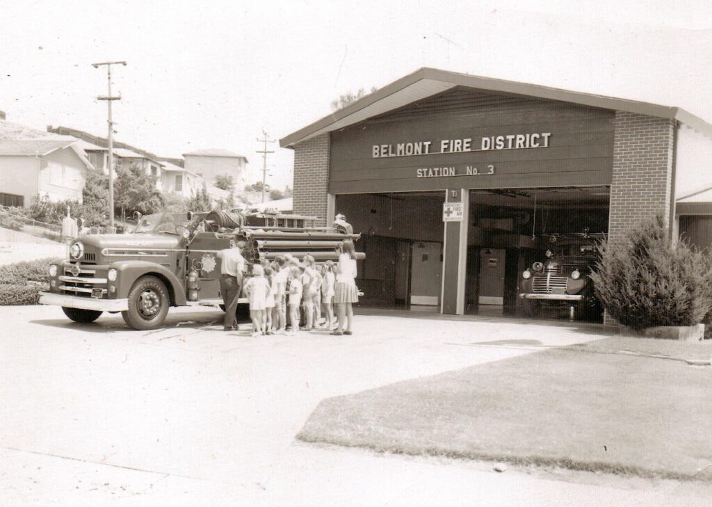 Children gather around a fire truck outside Belmont Fire District Station No. 3.