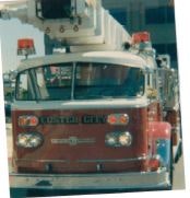 A red fire truck with a ladder and emergency lights, labeled "Oklahoma City."