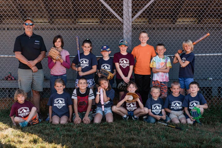 May contain: people, person, team, clothing, t-shirt, baseball, baseball glove, glove, sport, adult, male, man, shorts, boy, child, baseball cap, cap, hat, female, girl, accessories, glasses, face, head, photography, portrait, footwear, and shoe