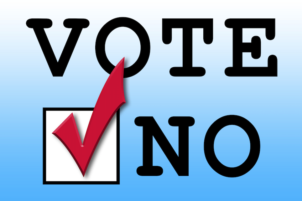 The image shows the word "VOTE" with a checkbox and a red checkmark next to "NO."