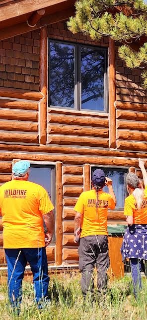 Wildfire safety ambassador looking for areas on the eves of the house.