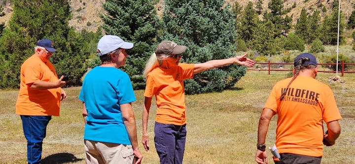 Wildfire Safety Ambassadors looking for areas around home that should be mitigated.