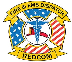 Fire & EMS badge with symbols of medical caduceus, stars, stripes, and a fire helmet, labeled "REDCOM".