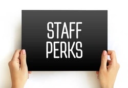 staff perks sign held by hands