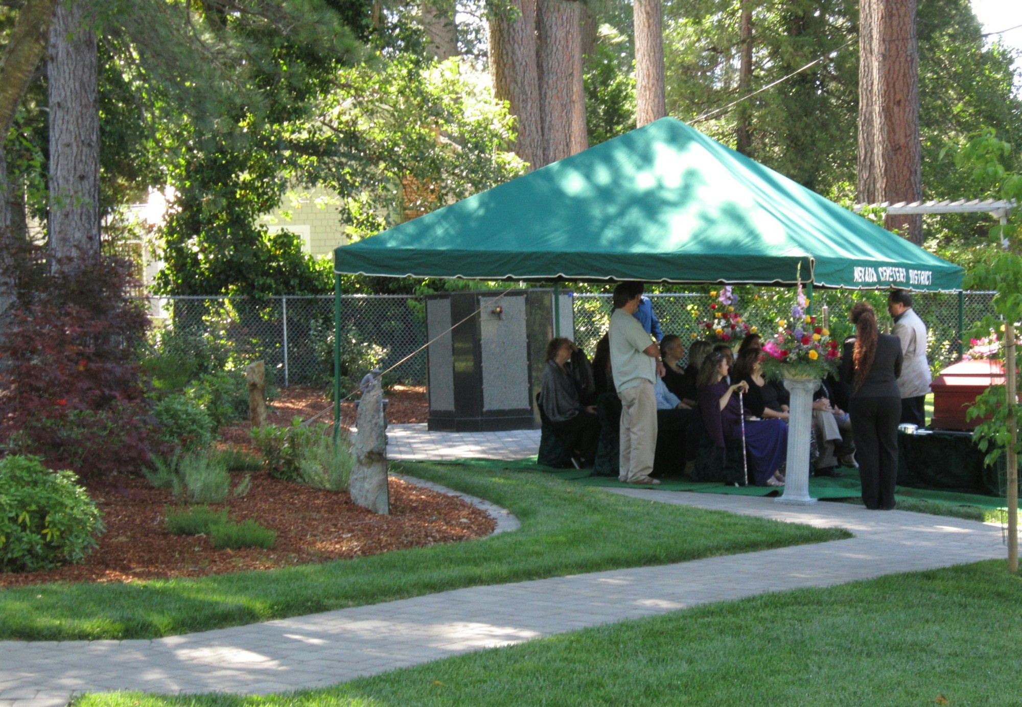 May contain: person, human, tent, gazebo, grass, and plant