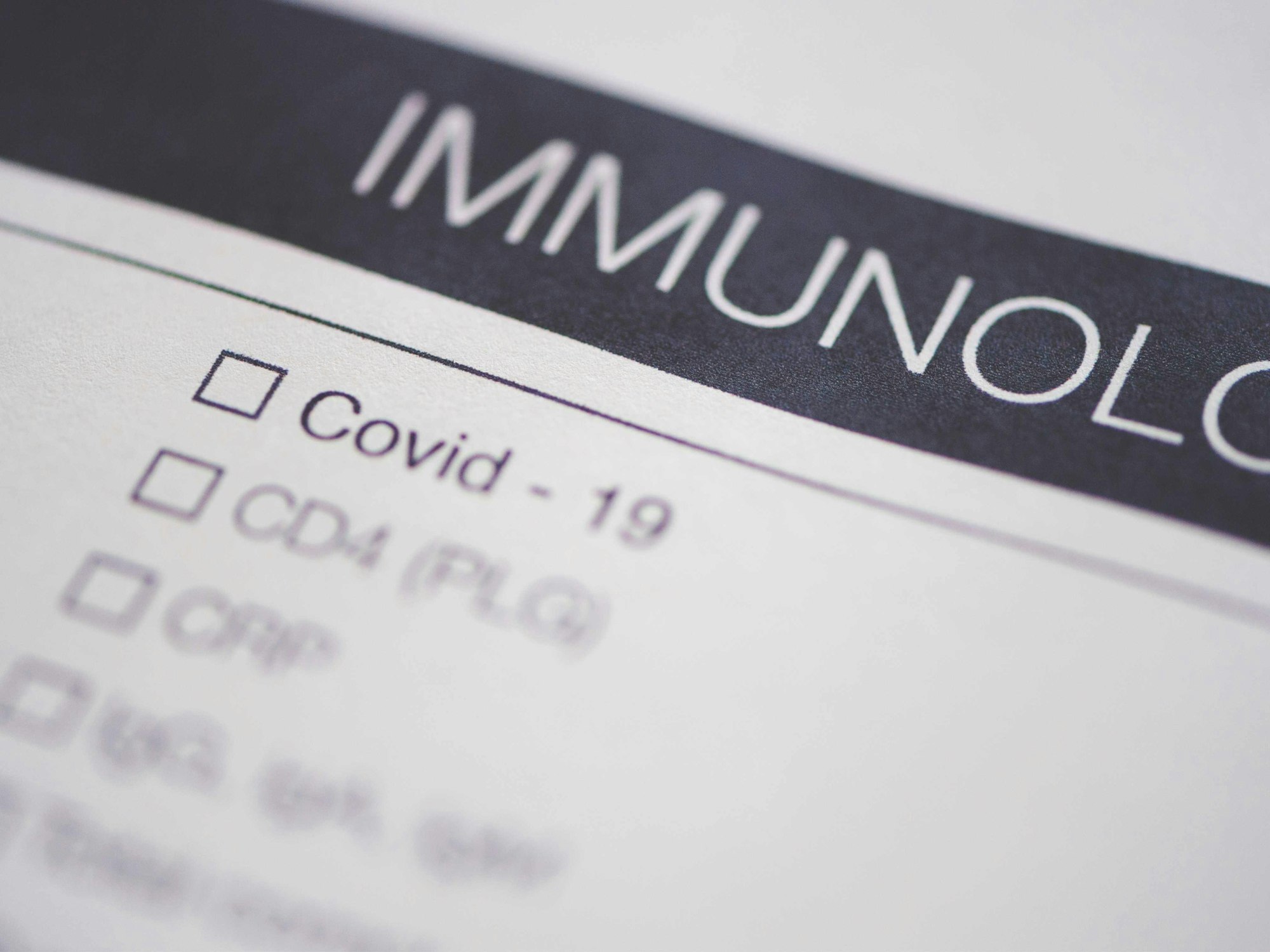 A document with the word "IMMUNOLOGY" and checkboxes, including one for "Covid - 19".