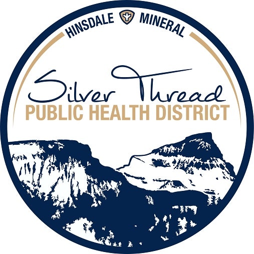 Logo of Silver Thread Public Health District with mountains and text within a circular seal.