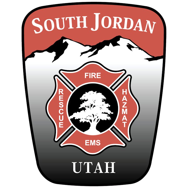 South Jordan, Utah fire department badge featuring mountains, a tree, and text: FIRE, RESCUE, EMS, HAZMAT.