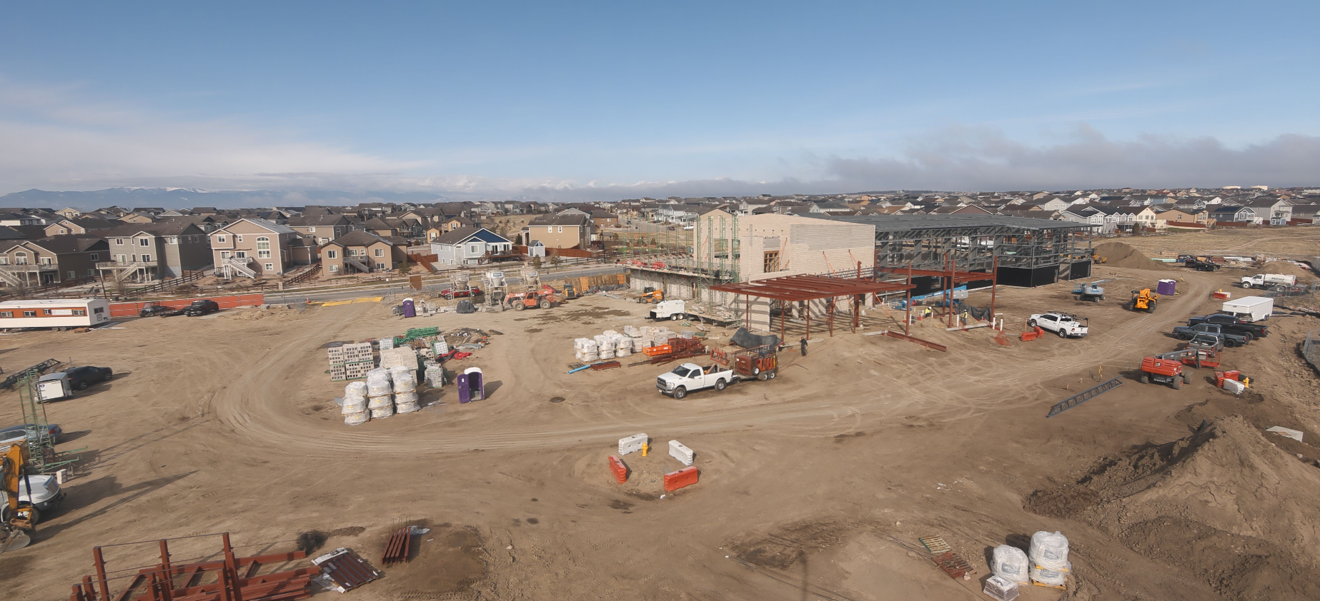 May contain: architecture, building, cityscape, urban, transportation, truck, vehicle, pickup truck, person, and outdoors