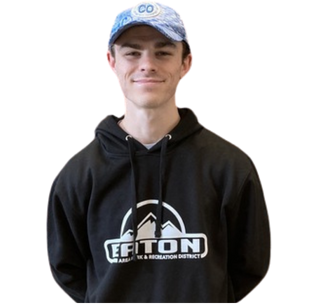 Ethan Chamberlain, a EAPRD certified personal trainer, wearing a blue cap and a black hoodie with a white EAPRD logo with a mountain graphic.