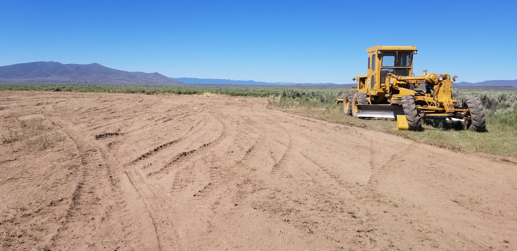 May contain: ground, soil, bulldozer, tractor, transportation, and vehicle