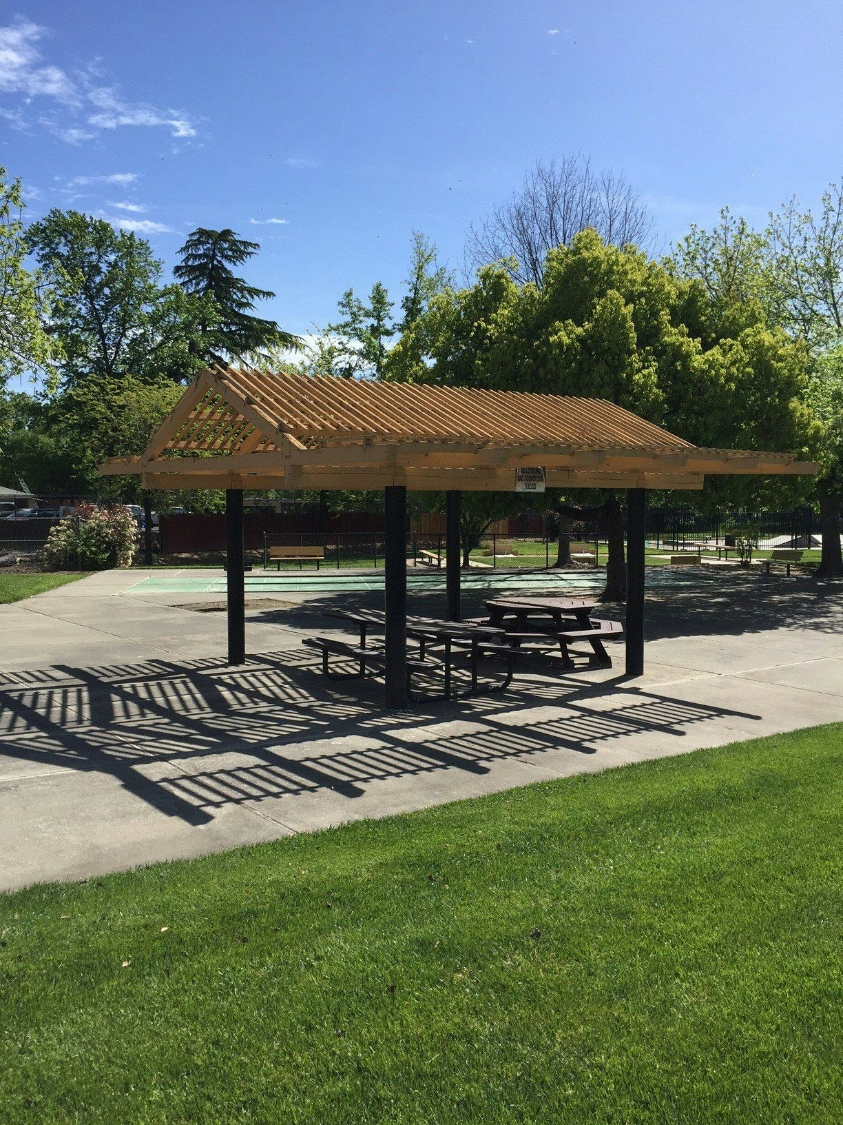 May contain: patio, porch, pergola, bench, and furniture