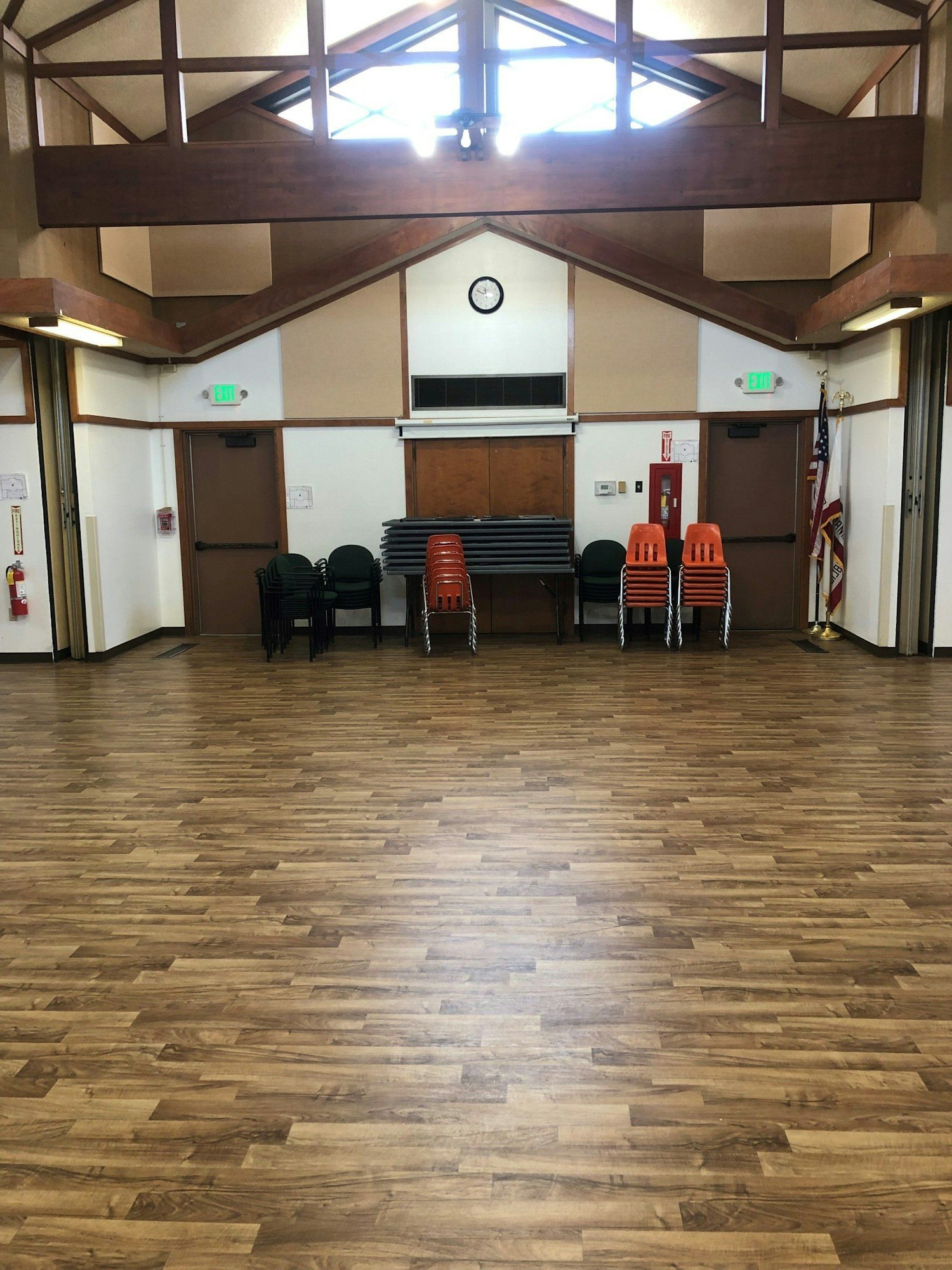 May contain: flooring, floor, furniture, chair, wood, hardwood, room, indoors, and rug