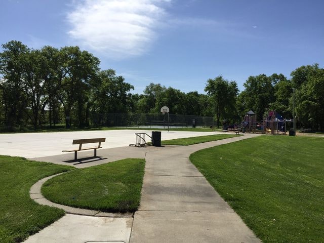 May contain: bench, furniture, grass, plant, path, park, outdoors, and lawn