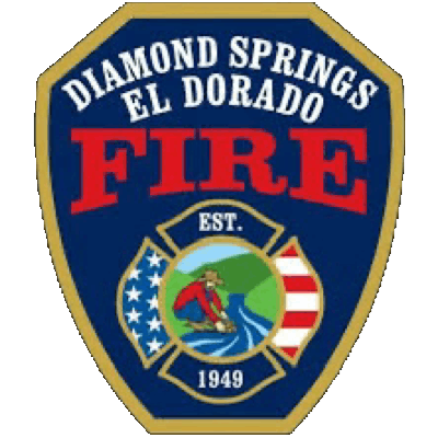 A badge emblem for Diamond Springs El Dorado Fire Department, established in 1949.