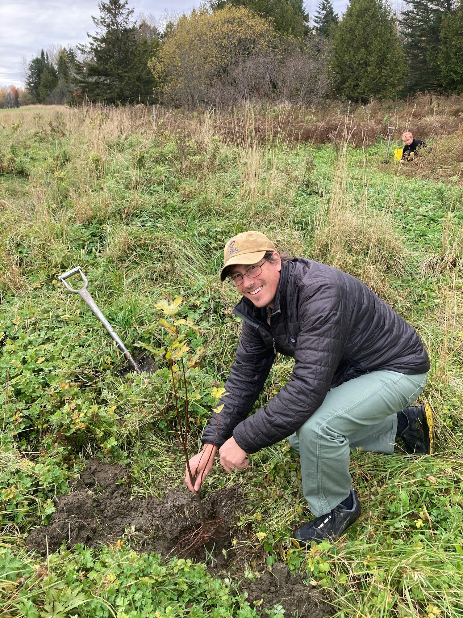 Ted planting trees in a riparian area