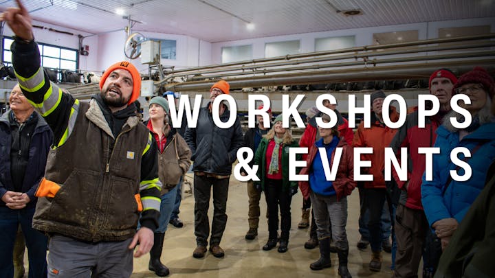 A group of people in a barn setting listens to a speaker, promoting workshops and events related to farming or agriculture.
