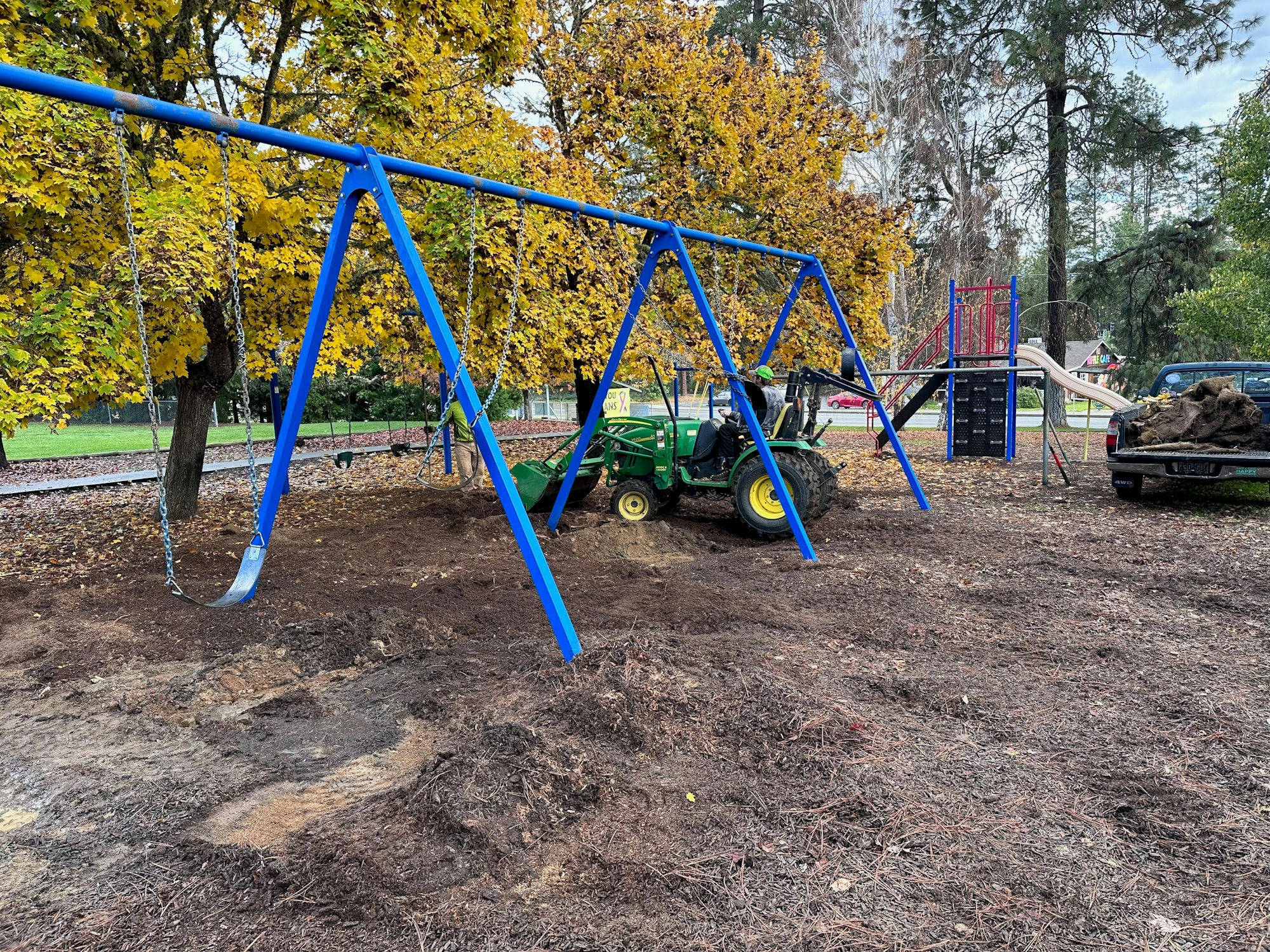 May contain: play area, outdoor play area, outdoors, person, helmet, car, transportation, and vehicle