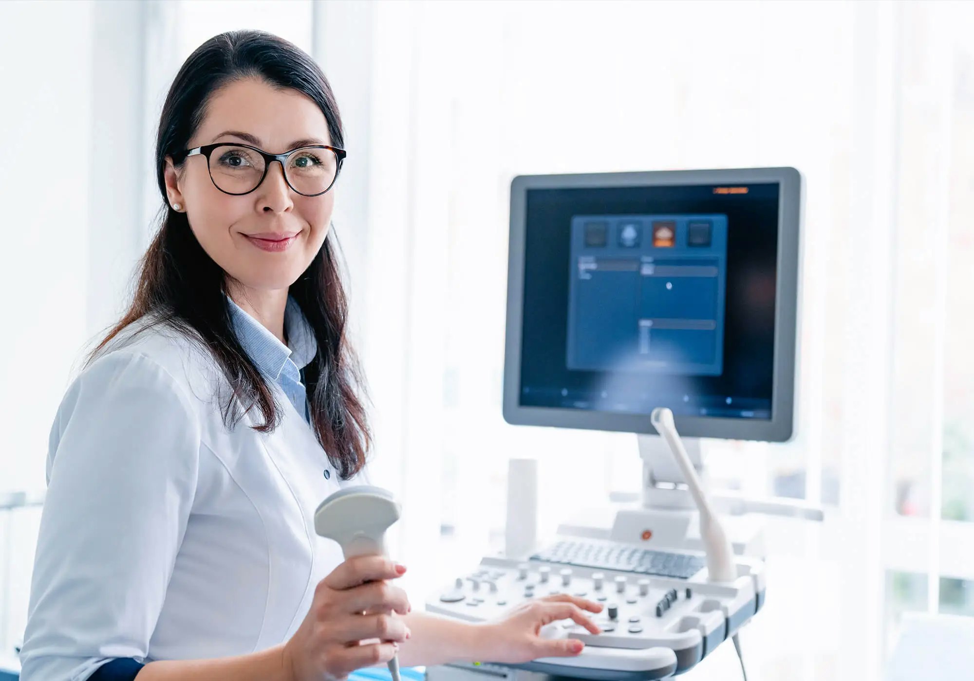 A medical professional with an ultrasound machine.