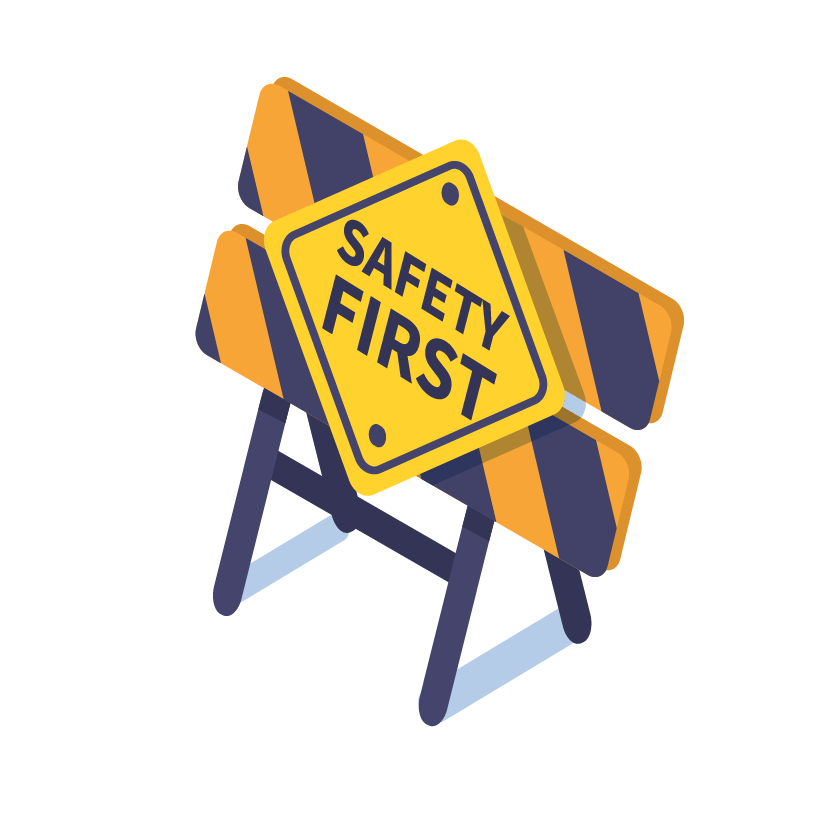 A "Safety First" sign on a barricade with orange and white stripes.