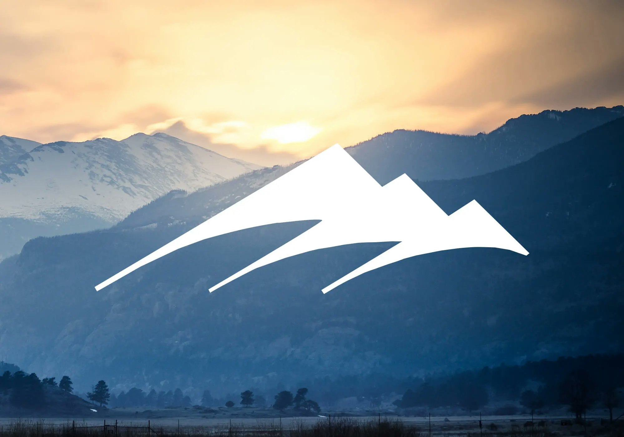 Sunset over snowy mountains with a graphic overlay.