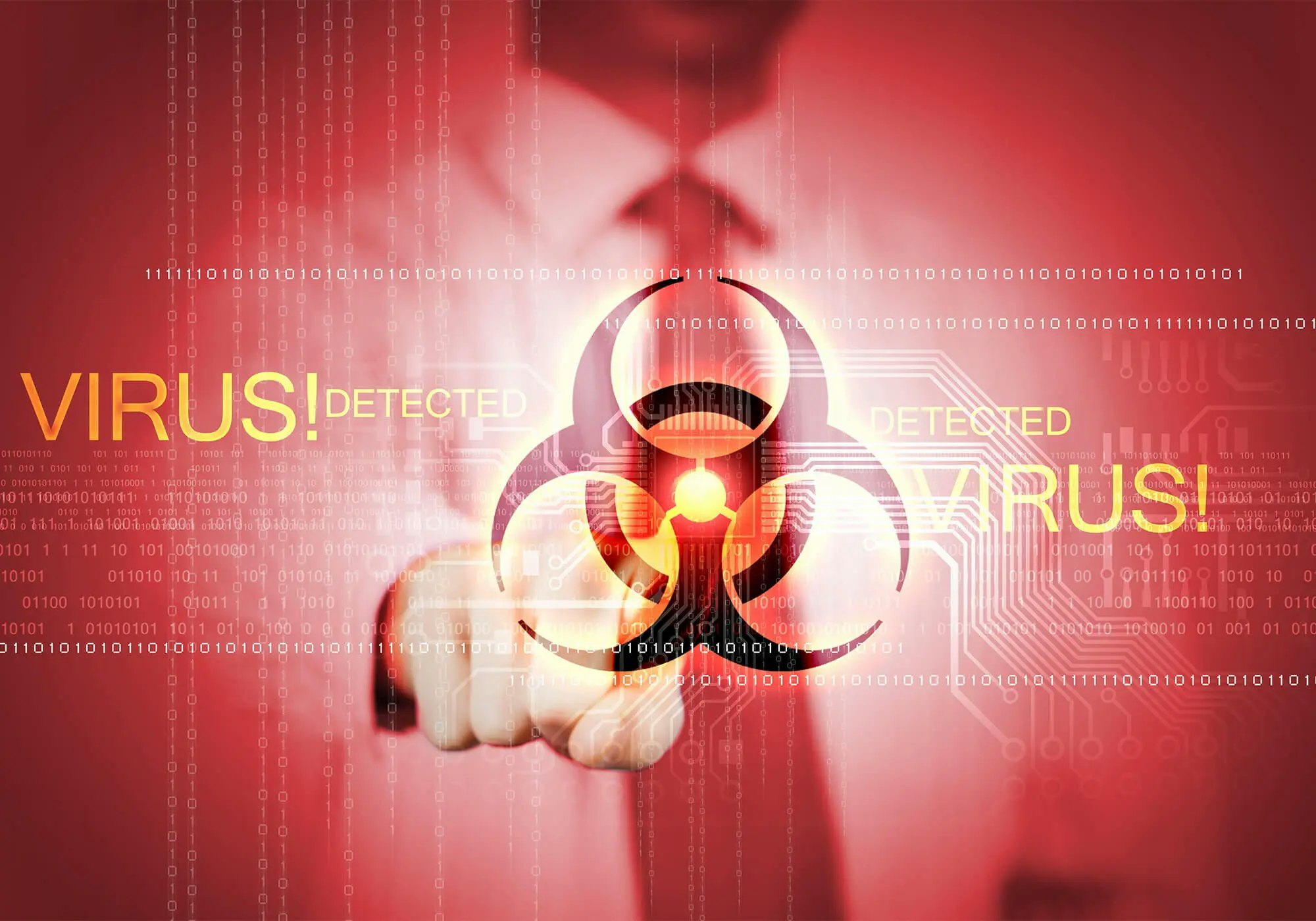 A person in suit with a virtual biohazard symbol and "VIRUS DETECTED" warnings, depicting cybersecurity threats.