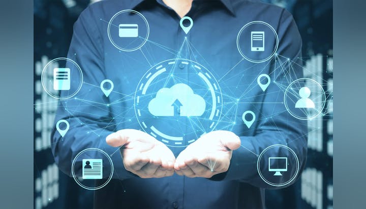 Person with holographic cloud computing icons floating above hands. Digital concept.