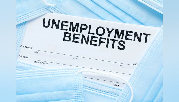 An unemployment benefits form on blue face masks.