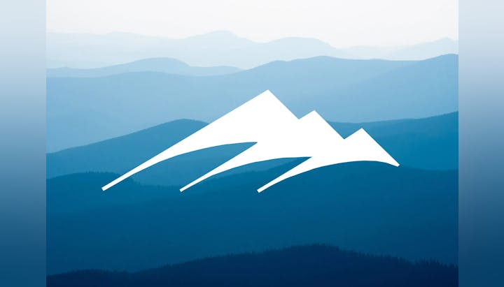 An abstract mountain range graphic with blue layered hills in the background.