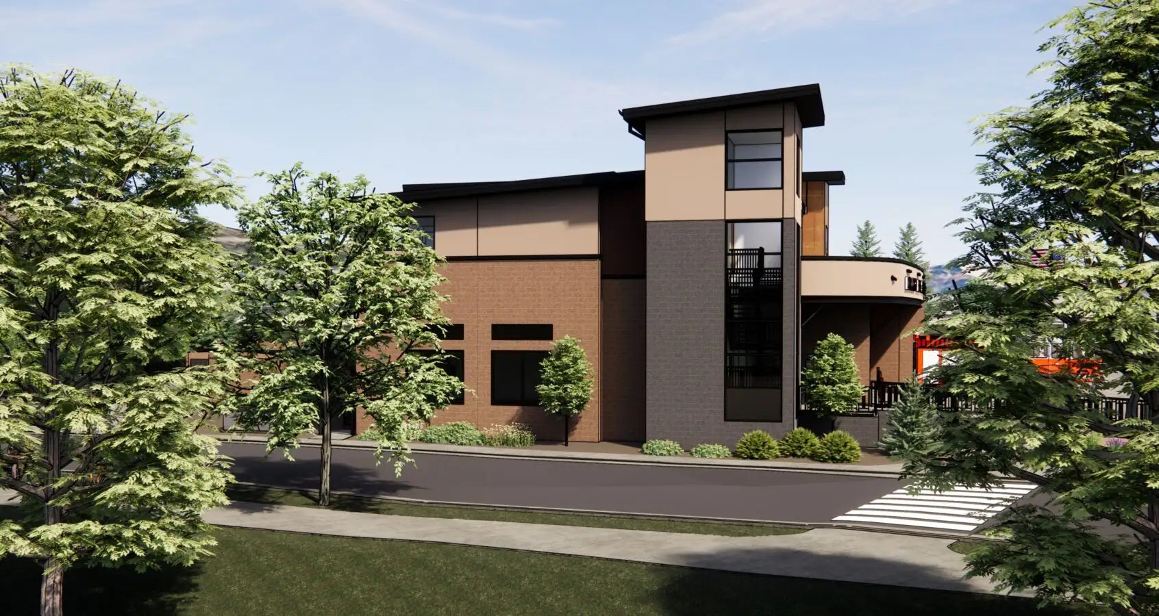 Modern two-story building with trees, pedestrian crossing, and clear skies.